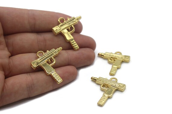 Gold uzi pendant discount