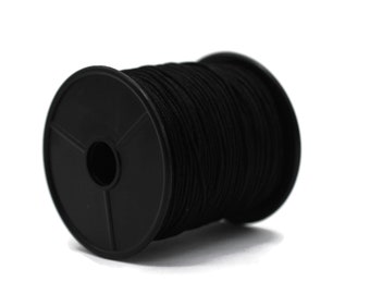 May include: A spool of black elastic cord, wound around a black plastic bobbin.