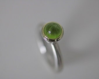 Delicate silver ring with a fine peridot cone set in gold by Frank Schwope, green, peridot, silver, engagement, gift, ring, unique