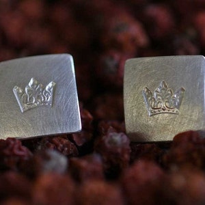Pair of ear studs with a punched crown in solid silver by Frank Schwope