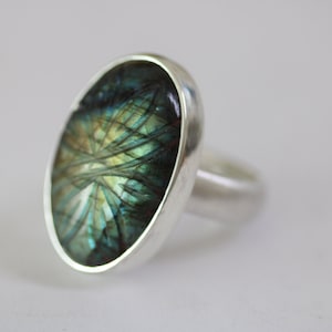 Sterling silver ring with oval engraved labradorite by Frank Schwope, labradorite, unique, Schwope, unique jewelry, green, blue, yellow, ring