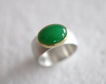 Ring in solid silver with beautiful oval green jade set in 18kt gold by Frank Schwope, solitaire, jade, unique jewelry, gold, handwork
