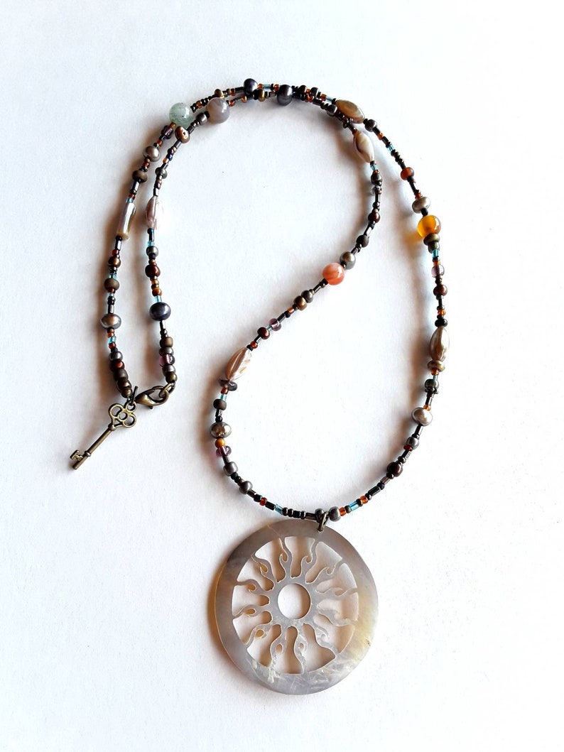 Bohemian Glass And Semiprecious Stone Beaded Necklace With Mother Pearl Cut Flaming Sun Pendant And Key Clasp Charm