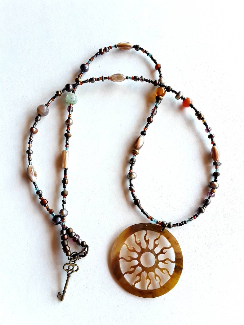 Bohemian Glass And Semiprecious Stone Beaded Necklace With Mother Pearl Cut Flaming Sun Pendant And Key Clasp Charm