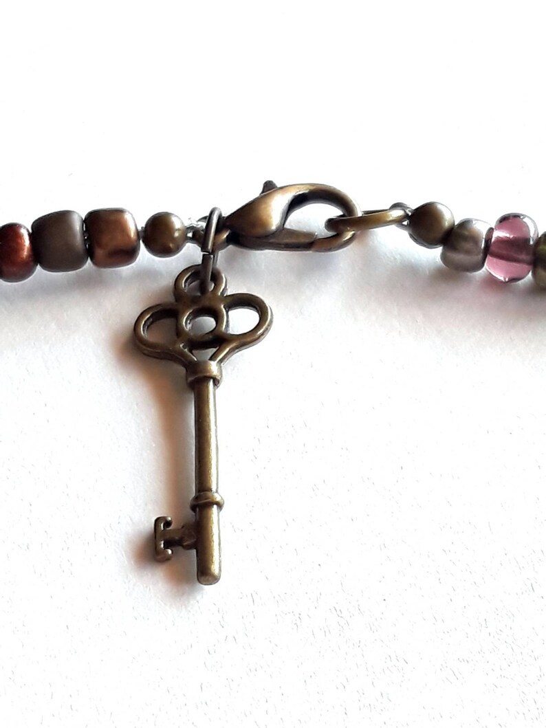 Bohemian Glass And Semiprecious Stone Beaded Necklace With Mother Pearl Cut Flaming Sun Pendant And Key Clasp Charm