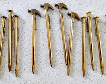 Vintage brass ink pens +  brass holder, 13 pieces total, 4 hammers, 4 nails, 4 screw shaped pens, 1 holder. Collectibles!