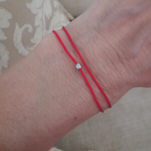 The Red string of fate bracelet.