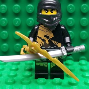 LEGO Ninjago: Lloyd Garmadon (Green Ninja) Minifigure with Shoulder Armor  and Two katanas (Swords)