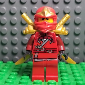 LEGO Ninjago: Lloyd Garmadon (Green Ninja) Minifigure with Shoulder Armor  and Two katanas (Swords)