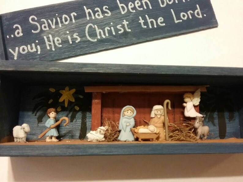 With wooden Manger and painted scene ...a Savior has been born to you; He is Christ the Lord Nativity scene slide top shadow box