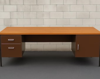 May include: A mid-century modern desk with a light brown woodgrain top and dark brown metal base. The desk has two drawers on the left and a cabinet on the right. The desk is approximately 60 inches wide.
