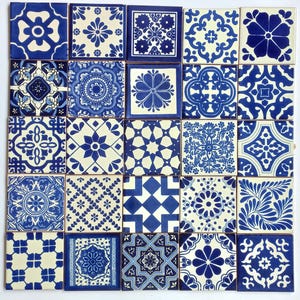 May include: A set of 25 blue and white ceramic tiles with intricate geometric and floral patterns. The tiles are arranged in a grid pattern, creating a visually appealing mosaic.