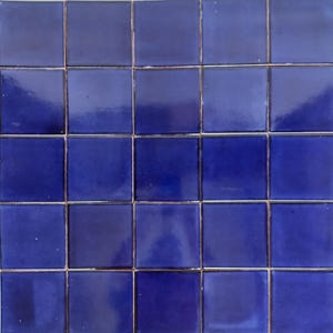 May include: A sheet of small, square, blue ceramic tiles. The tiles are arranged in a grid pattern.