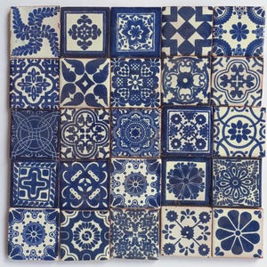 May include: A collection of 25 blue and white ceramic tiles with intricate geometric and floral patterns. The tiles are arranged in a grid pattern and have a slightly distressed look.