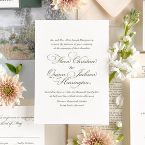 May include: A white wedding invitation with black calligraphy announcing the marriage of Flora Christine to Quinn Jackson Harrington. The wedding will take place on Saturday, 7th June 2025 at 4:30 PM at the Missouri Botanical Garden in Saint Louis, Missouri.