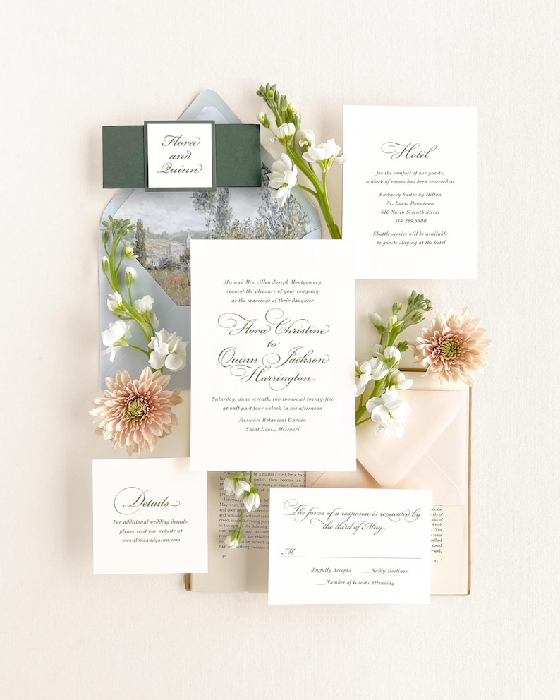 May include: Wedding invitation suite with a floral theme. The invitation features a white card with black calligraphy text that reads "Flora Christine to Quinn Jackson Harrington." The RSVP card features the text "The favour of a response is requested by the third of May."