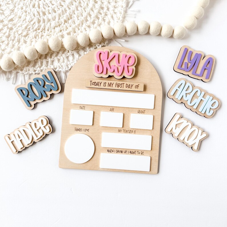 Interchangeable and reusable first/last day of school sign.  Features magnetic interchangeable names in your choice of color, velcro first/last day of school pieces and white dry erase areas to fill in milestones!