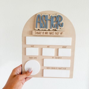 Interchangeable and reusable first/last day of school sign.  Features magnetic interchangeable names in your choice of color, velcro first/last day of school pieces and white dry erase areas to fill in milestones!