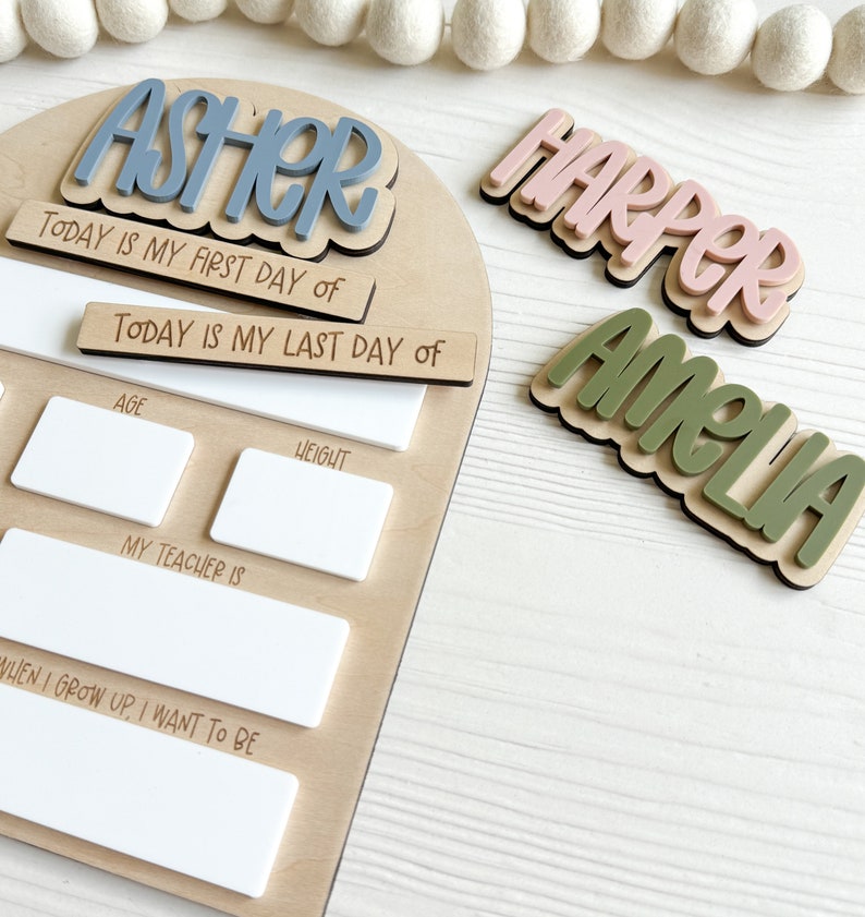 Interchangeable and reusable first/last day of school sign.  Features magnetic interchangeable names in your choice of color, velcro first/last day of school pieces and white dry erase areas to fill in milestones!