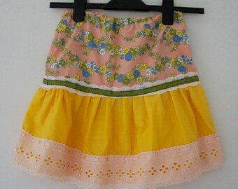 Cute Floral Peach Vintage Fabric And Yellow Cotton Girl's Skirt With Wide Peach Lace Ribbon Trim Lace And Green Ribbon Detail Age 2-4 Yrs