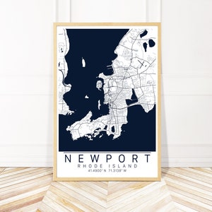 May include: A navy blue map print of Newport, Rhode Island, with white lines showing the streets and waterways. The text "NEWPORT" and "RHODE ISLAND" is printed in white at the bottom of the map, along with the coordinates "41.4900&deg; N 71.3138&deg; W".