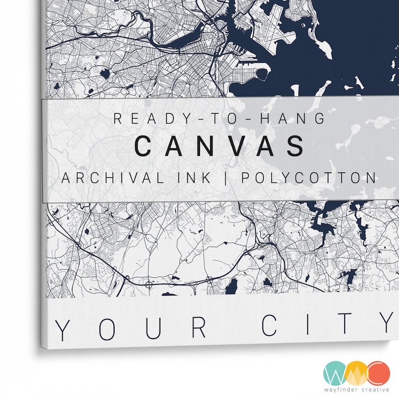 May include: A white canvas print with a map of a city in blue and white. The text "READY-TO-HANG CANVAS ARCHIVAL INK | POLYCOTTON YOUR CITY" is printed on the canvas.