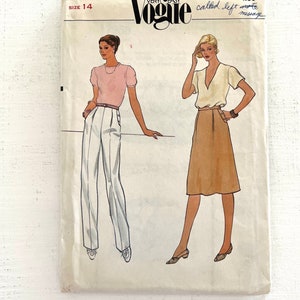 May include: Vintage Vogue Very Easy pattern 7958, size 14, featuring illustrations of women's clothing designs. The cover shows a pink top with white pants and a tan skirt with a wrap top. Handwritten notes and the Vogue logo are visible.