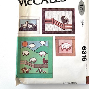 May include: A McCall's sewing pattern for a quilt with a farm theme. The pattern includes four different blocks: a rooster in a pen, a sheep, a field with sheep and a rooster, and two ducks. The pattern number is 6316 and the price is $1.75.