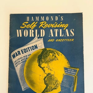 May include: A vintage "Hammond's Self Revising World Atlas and Gazetteer" cover. The cover is dark blue with yellow text and a yellow globe illustration. Includes a newspaper graphic with "War Edition" text and a microphone.