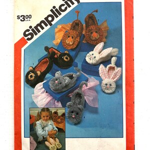 May include: Simplicity sewing pattern number 6231 for adult-sized animal slippers. The pattern includes instructions for making lion, bear, bunny, and cat slippers. The pattern is $3.00.