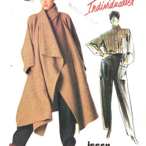 May include: A Vogue Patterns Individualist sewing pattern envelope for Issey Miyake design 1476. The cover features a photograph of a tan, oversized, open-front coat worn over dark trousers, alongside a fashion illustration of the same outfit.