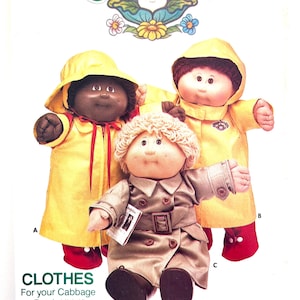 May include: A vintage Cabbage Patch Kids pattern featuring three dolls. Two dolls wear yellow raincoats with red accents and boots. The third doll is dressed in a tan trench coat. The pattern includes the text "CLOTHES For your Cabbage Patch Kids!"