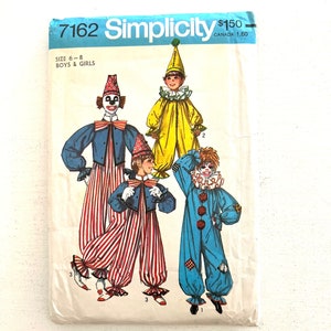 May include: Vintage Simplicity sewing pattern 7162 for clown costumes, size 6-8. The pattern features illustrations of four different clown outfits in blue, yellow, and red, with striped pants and ruffled collars. The pattern is for boys and girls.