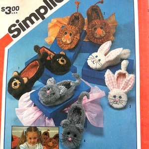 May include: A Simplicity sewing pattern for making animal slippers. The pattern number is 6231. The pattern includes instructions for making lion, bear, bunny, and cat slippers.
