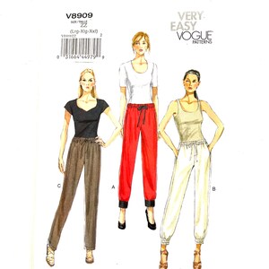 May include: A sewing pattern for pants with three different styles. The pattern is for sizes large, extra large, and extra extra large. The pattern is from Vogue Patterns and is labeled "Very Easy".