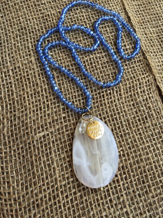 Items similar to Periwinkle blue beaded necklace with faux offwhite