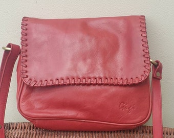 Red Leather Cross Body Messenger Bag from Gigi.  Woven leather edging.  Soft red leather satchel shoulder bag.