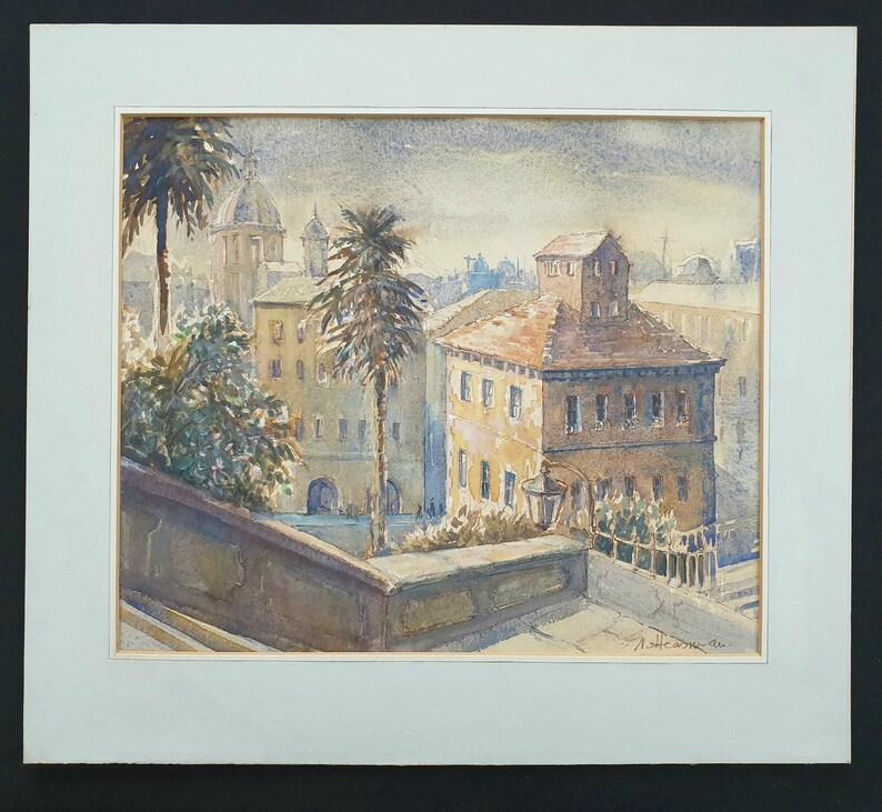 May include: Watercolor painting of a European cityscape with buildings, palm trees, and a domed structure in the background. The artwork is framed with a white mat and a black border. The painting has a vintage aesthetic.