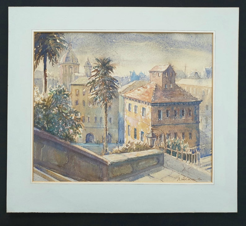 May include: Watercolor painting of a European cityscape with buildings, palm trees, and a domed structure in the background. The artwork is framed with a white mat and a black border. The painting has a vintage aesthetic.