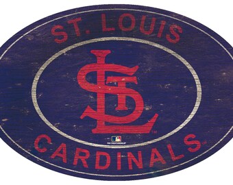 May include: A distressed wooden oval sign with the text "ST. LOUIS CARDINALS" in red and white lettering. The sign features a red "STL" logo in the center.