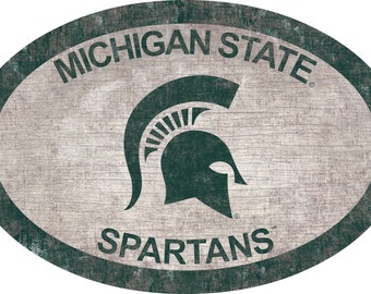 May include: A distressed wood oval sign with a green Spartan helmet and the text "MICHIGAN STATE" and "SPARTANS".