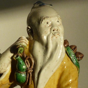 Qing dynasty famille verte biscuit figure of Dongfang Shou