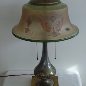Pairpoint lamp with stylized owl face glass shade
