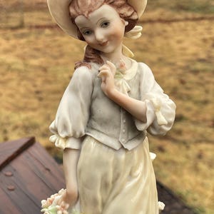 Giuseppe Armani&#39;s &#39; Young girl with basket of roses&#39;