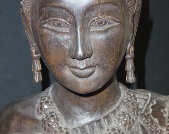 Hand carved Buddhist female figure