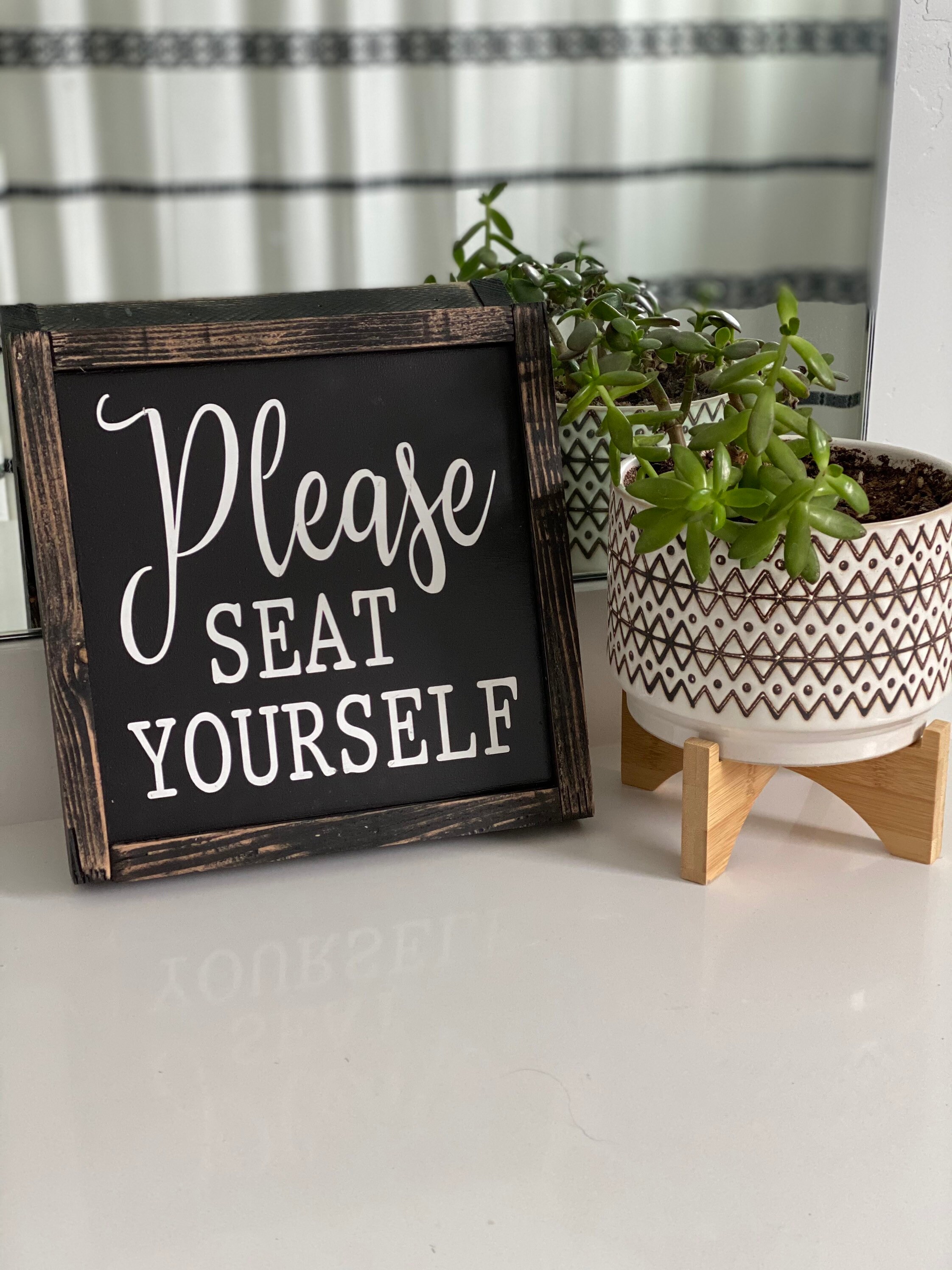 Please seat yourself bathroom sign