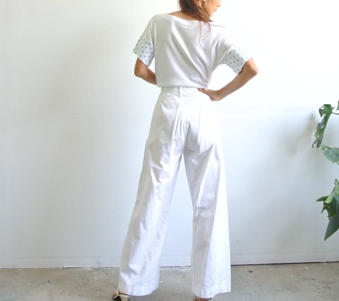white sailor pants with gold buttons