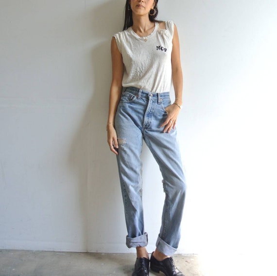 Vintage 1970s distressed Levi's 505 patched jeans
