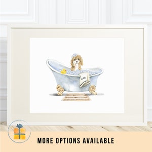May include: A watercolour illustration of a brown and white dog sitting in a blue bathtub with a yellow rubber ducky and bubbles. The dog is wearing a white towel with the name "Bobby" written on it.