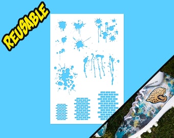 May include: Reusable stencil sheet featuring a variety of paint splatter designs and brick patterns. The stencil is white with blue cutouts.